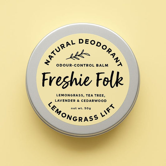 Tin of Freshie Folk natural deodorant on a yellow background